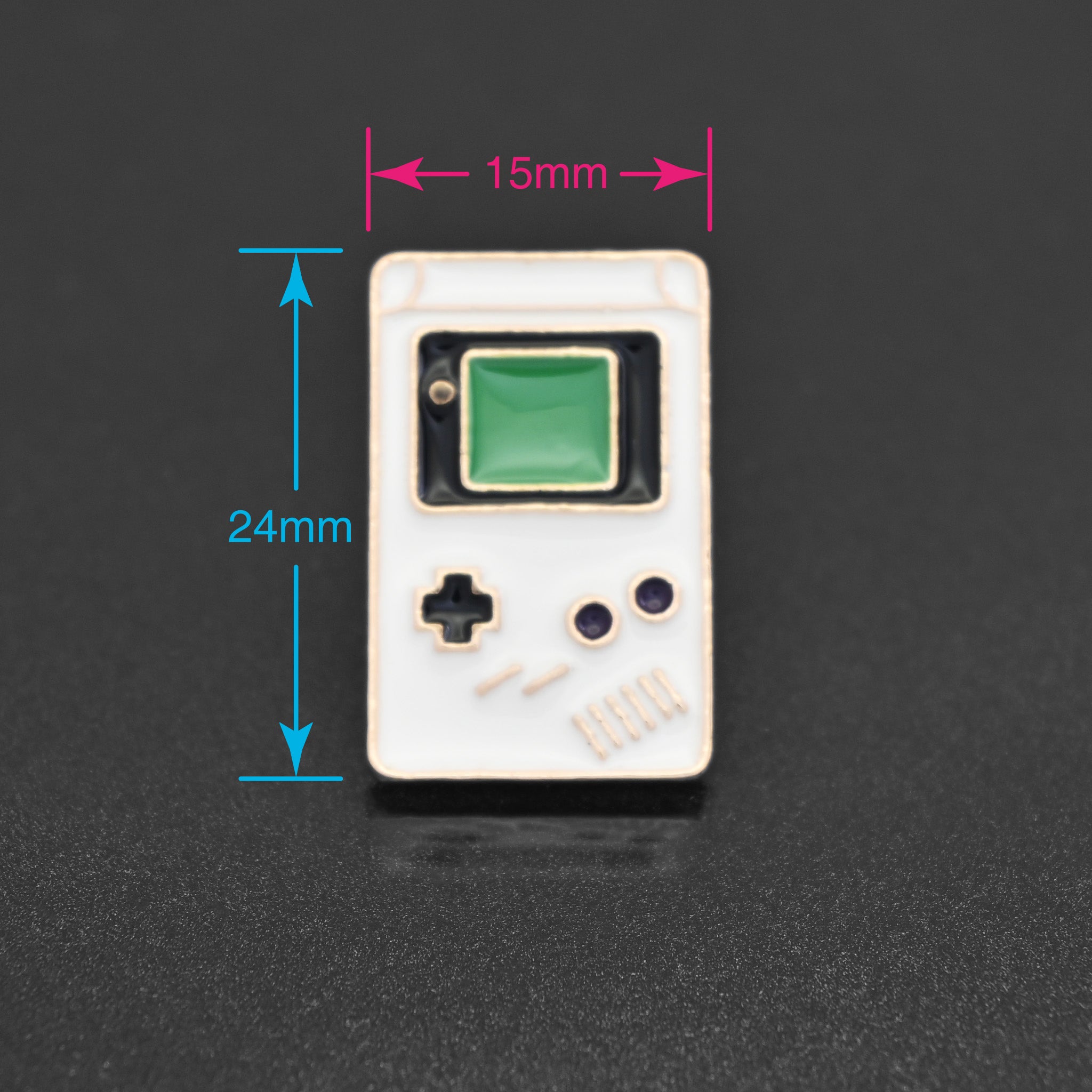 A cute little enamel pin of a white Nintendo Game Boy