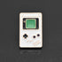 A cute little enamel pin of a white Nintendo Game Boy