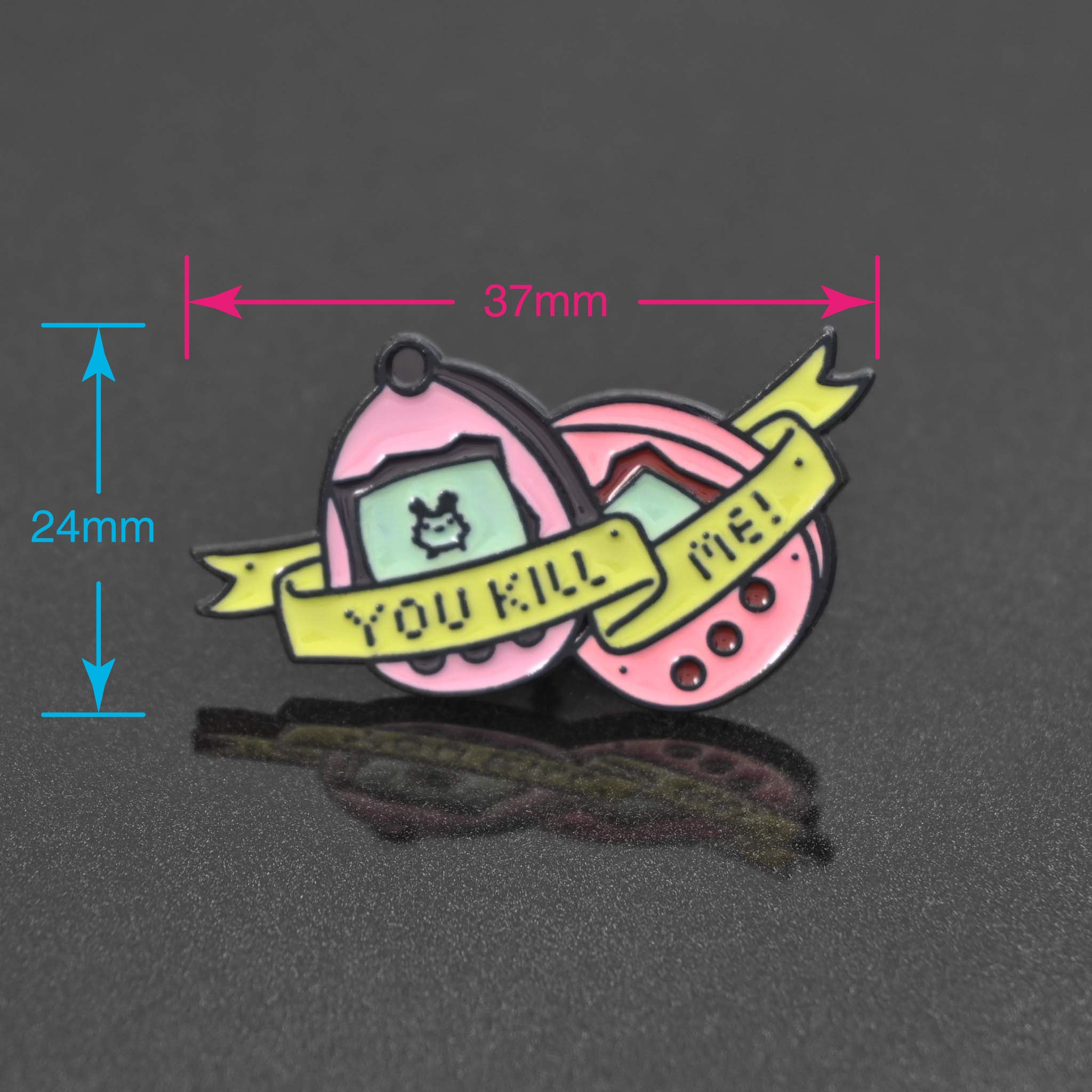 Tamagotchi enamel pin with a banner that reads You Kill Me!